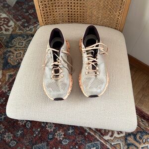 On Running Orange and Silver Athletic Shoes